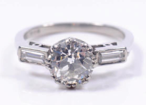 207. A platinum and diamond single stone ring with round old, brilliant-cut stone approximately 8mm x 5mm estimated to