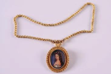 140. A 9ct gold and diamond mounted portrait miniature pendant depicting