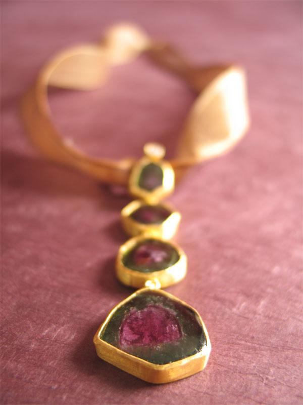 7 inches (45 cm) This elegant handmade 24k gold pendant with four tourmaline stones and a single diamond