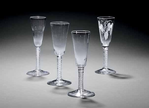 694 697 Three Double-series Opaque-twist Stem Wineglasses, England, c. 1770, all three with ogee bowls and conical feet: one with a pair of spiral threads outside gauze stem, ht.
