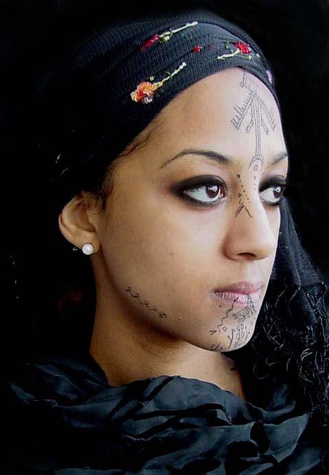 4 Algerian woman #70 overlaid her tattoos with harquus or kohl and face paint.