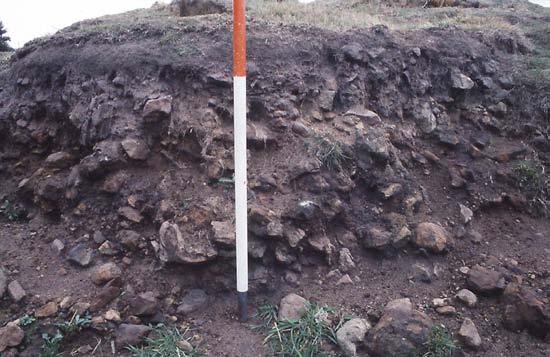 Fig. 2. A burnt mound at Jenny s Lantern, Northumberland, being gradually eroded by a stream. The compact burnt stones and charcoal-rich soils can be seen below the turf. Fig. 3.