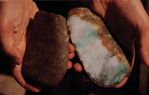 River jade, the jadeite recovered from alluvial deposits in and along the Uru River, occurs as rounded boulders with a thin skin (figure 14, top left).