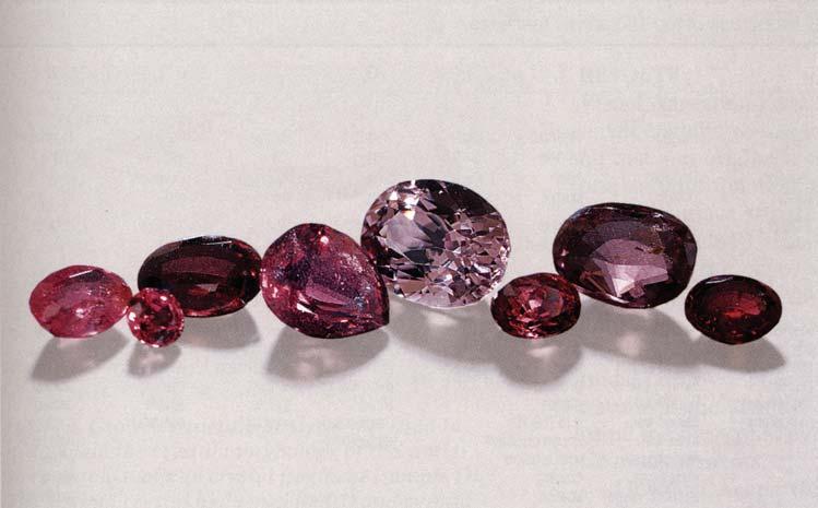 Figure 1. Purple to purplish red, Cr-bearing taaffeite is a very rare gem. Six of the study samples shown here fall into this color range.