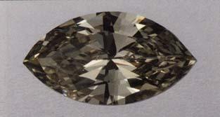 These two diamonds, 0.74 (top) and 31.10 ct, are typical of the yellowish green to greenish yellow colors seen in chameleon diamonds. heated.