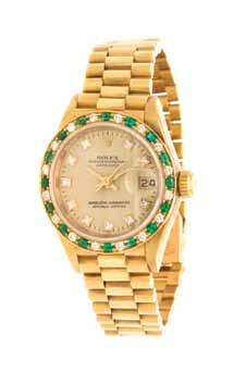57 An 18 Karat Yellow Gold, Emerald and Diamond President Datejust Wristwatch, Rolex, Ref. 69198, 26.