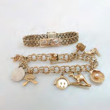 139 10K YELLOW GOLD CHARM BRACELET set with 8 various gold and metal charms; with 10k