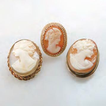 1 grams $275 350 143 14K YELLOW GOLD RING bezel set with an oval carved shell cameo;