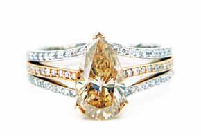 02ct G/SI 15,825 Tinted pear shape diamond ring.