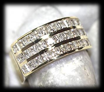 77 9 carat yellow polished gold cubic zirconia RING of modern broad design.