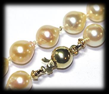 Strung and knotted to a length of 46cm onto a 9 carat yellow polished gold ball clasp. Mass: 28.17 gram.