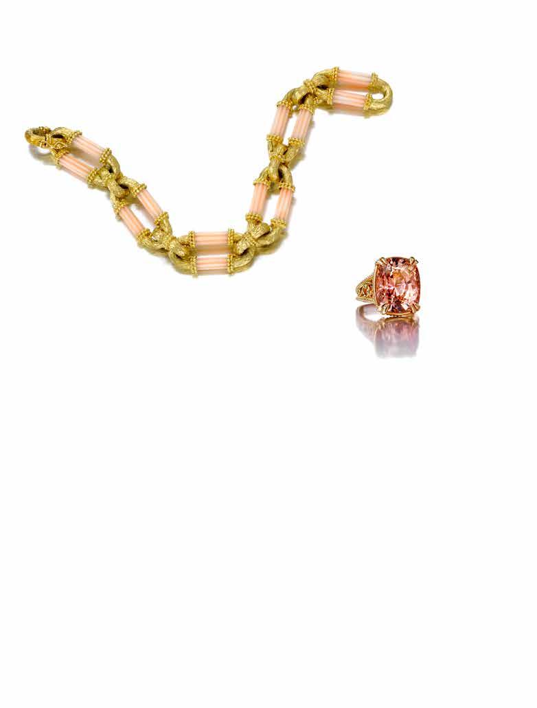 42 43 42 Y A CORAL AND 18K GOLD BRACELET of flexible oval link design, accented with carved coral bars; gross weight approximately: 72.70 grams; length 7 3/4in.