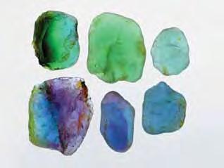 While much of the tourmaline rough is monochromatic and yields stones of a single hue (figure 19), some pieces show noticeable color zoning, commonly in irregular patterns (figure 20).