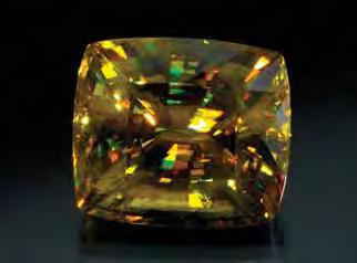 Figure 3. This 76.27 ct sphene is notable for its large size and vibrant display of dispersion. Courtesy of H. Obodda, Short Hills, New Jersey; photo by Robert Weldon.