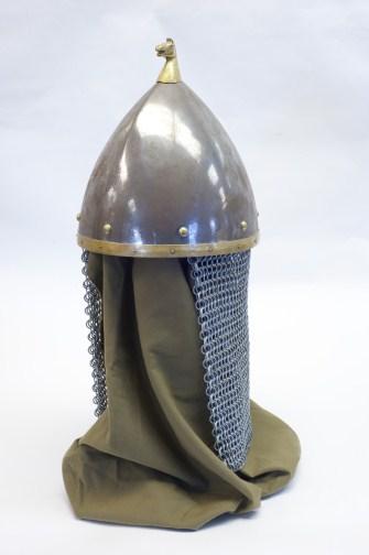 Metal Helmet with Chainmail Backing This helmet provides heavy protection of the head with light maneuverable chainmail protecting the back of the neck