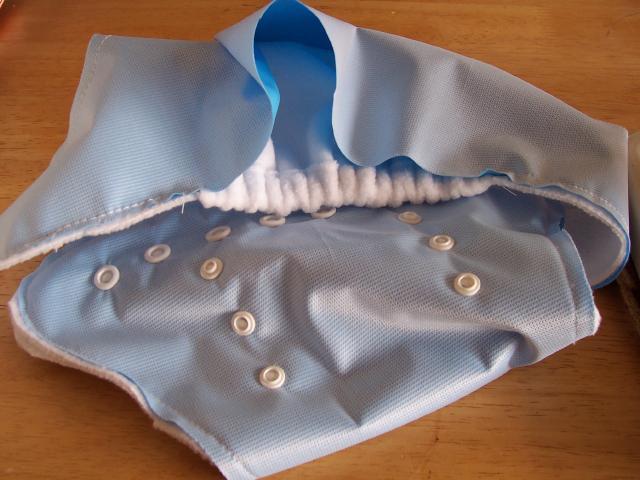 Starting at the pocket opening (I started where there is a black bull dog clip), straight sew around the entire nappy, finishing at the other side of the pocket