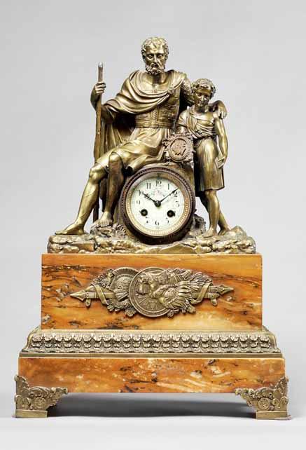 a peacock at her side, each on shaped square bases, the three pieces each with incised interlaced L marks and stamped A.P to the underside The clock 32cm high; the figures 31cm high. 300-500 (+26.