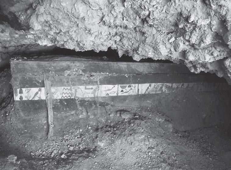 EXCAVATIONS AT THE COURTYARD OF THE TOMB OF DJEHUTY 217 Fig. 8. Early Eleventh-Dynasty burial under the court s floor. The coffin, painted in red and inscribed, belonged to a man called Iqer.