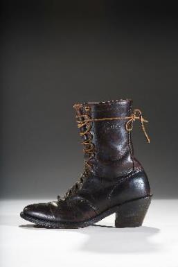 This unembellished boot was made by Justin Boots, one of the oldest cowboy boot makers dating to the 1879. The embroidered example was made by Tony Lama established in 1911.
