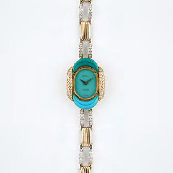 55 LADY S DE LANEAU WRISTWATCH 17 jewel movement; turquoise dial signed Secrett s; in an 14k yellow and white gold case and strap set with two carved turquoise panels and 154 small single cut