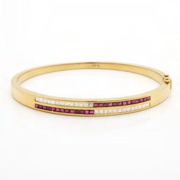 61 18K YELLOW GOLD HINGED BANGLE channel set with 26 square cut rubies (approx. 1.20ct.t.w.) and 26 square cut diamonds (approx.