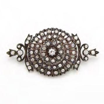 67 9K YELLOW GOLD AND SILVER FILIGREE BROOCH/PENDANT set with 62 various old cut diamonds (approx. 1.75ct.t.w.), 15.