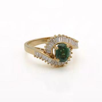 1 grams $1,000 1,500 87 18K YELLOW GOLD RING set with an oval cut tsavorite (approx. 0.90ct.
