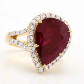 155 18K YELLOW GOLD RING set with a pear cut ruby (approx. 3.60ct.) encircled by 47 brilliant cut diamonds (approx. 1.00ct.t.w.), size 7, 8.