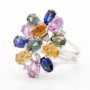 13 18K WHITE GOLD RING set with 12 various coloured oval cut sapphires (approx. 7.00ct.t.w.) and 5 small brilliant cut diamonds, size 7, 8.