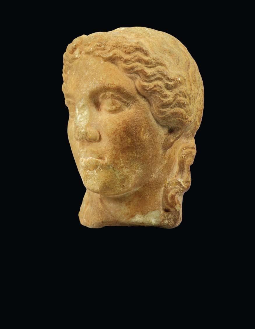 GREEK HELLENISTIC MARBLE HEAD OF APOLLO Apollo was a Greek and later Roman sun god. He represented music, poetry, medicine and the civilized arts.