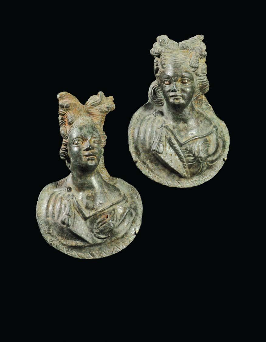 ROMAN TWO ROMAN ROUNDEL BRONZE APPLIQUES Each roundel has a bust of Artemis, or perhaps a maenad, in high relief, wearing a chiton with a nebris tied over the right shoulder, the elaborate coiffure