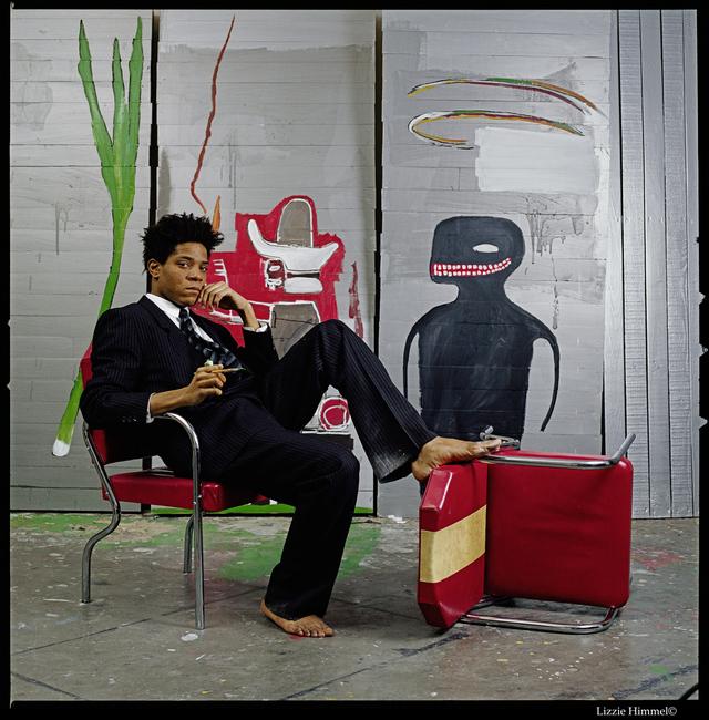 Jean-Michel Basquiat in his studio at the Great Jones Street, New York, 1985In front of Untitled, 1985, Acrylic and oilstick on wood, 217 x 275,5 x 30,5 cm (detail) Private Collection, Photo: Lizzie