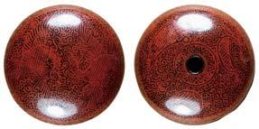 0 cm in diameter, 1.8 cm high Fig. 23: Another manju netsuke, decorated in Kinma style with red lines on black lacquer ground.