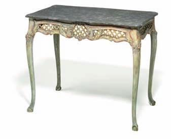DKK 8,000-10,000 / 1,050-1,350 172 An Italian painted table with faux marble top and openwork apron carved with flowers and foliage, cabriole legs, claw and ball. 19th century, restored.