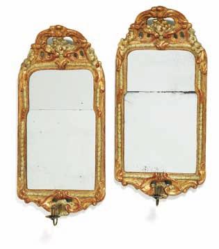 186 186 a pair of signed rococo giltwood bracket mirrors, each with one brass arm for candle. Marked ns for nils sundström b. stockholm 1727, d. 1781 and received a royal priviledge in 1757.