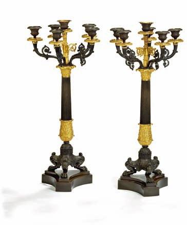245 a pair of large french charles X gilt and patinated bronze candelabra, each with six curved arms for candles, fluted stems on tripod bases. france, mid 19 century. H. 67 cm.