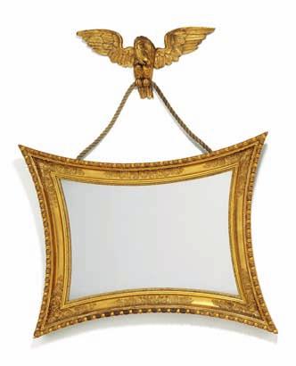 263 a swedish empire giltwood and gezzo mirror with concave sides, hanging with eagle. c. 1830. H.