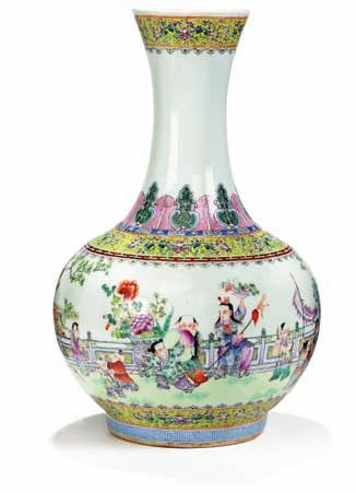 335 335 Chinese porcelain balustervase, decorated in colours with playing children in scenery.