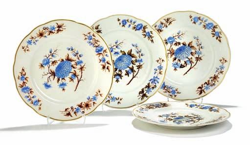 370 370 Four russian porcelain plates with lobed rim, decorated in colours and gold with blue flowers on white ground.