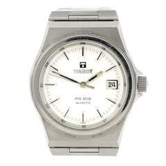 61 # 64 TISSOT - a gentleman s PR50 bracelet watch. Stainless steel case. Reference TKP-JA, serial 11590. Unsigned quartz movement. White dial.