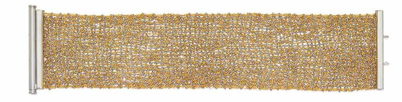32 31 34 33 35 36 31 A FANCY COLORED DIAMOND AND 18K BI-COLOR GOLD LONG CHAIN vari-cut natural fancy light yellow, yellow and intense yellow diamonds, weighing in total: 9.23cts; length: 60in.