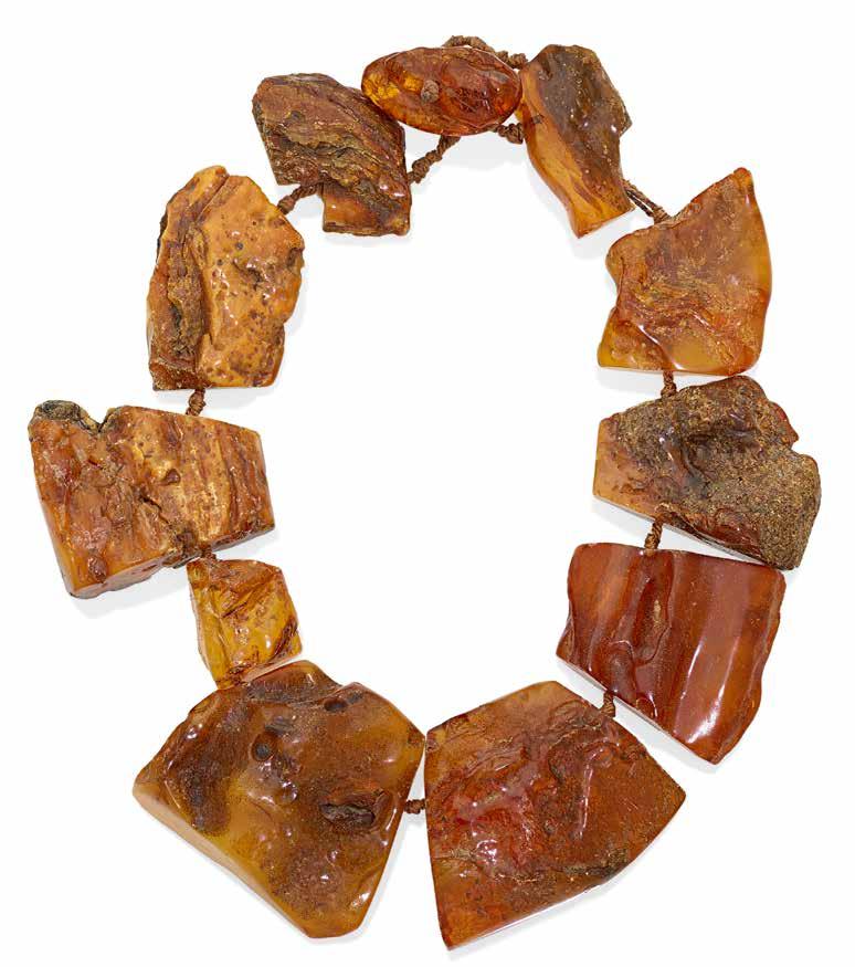 395 PROPERTY OF A NEW YORK COLLECTOR 394 AN AMBER TORSADE NECKLACE with polished amber beads and tumbled amber; length: 40in.