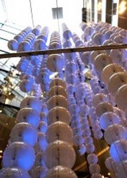 spheres suspended on metal cables that