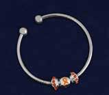 A sterling silver plated threaded snake chain that has 3 charms on it. An orange ribbon charm and 2 orange crystal accent charms.