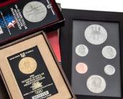 A collection of modern proof and other coins, including a 1983 silver one pound, two Charles & Diana silver crowns, two 1981 Twala ten dollar silver coins, all boxed,