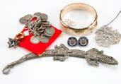 522. A small group of jewellery, including a rolled gold bangle and pin brooch, a silver and coin bracelet and more (parcel) 527.