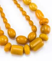 604. An unstrung Art Deco period amber bead necklace, ovoid beads, approx 70g (parcel) 150-250 600.