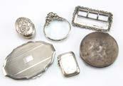 Six Victorian and first half 20th Century small silver items, including a pill box, vesta case, two compacts, a magnifying glass and a belt buckle (6) 40.