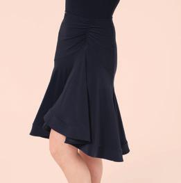 It features flattering rouching to the hip and a crinoline hemline to add