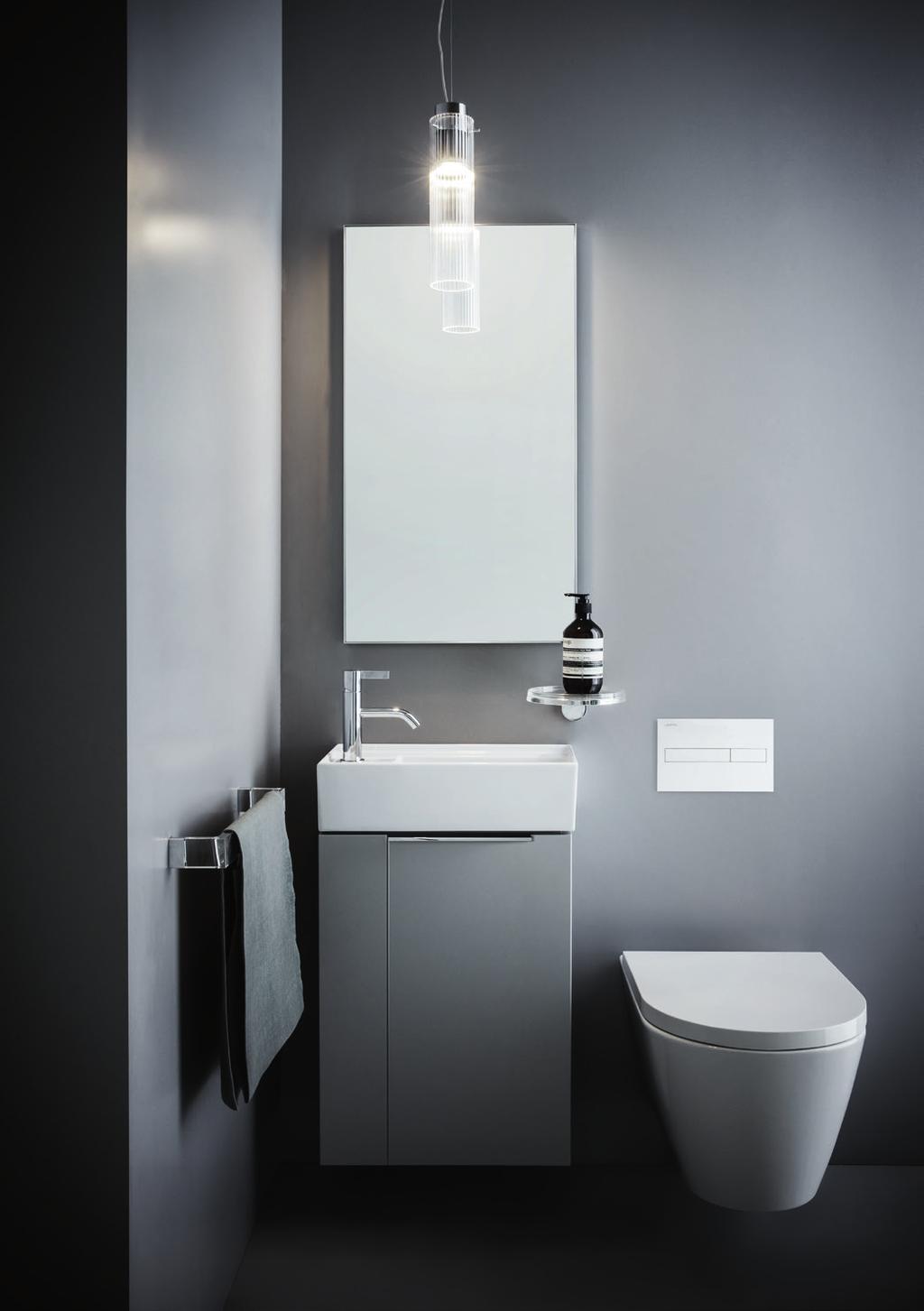 Asymetric small washbasin 46 with vanity unit Wall-hung WC Mirror Frame 25 Pendant lamp 'Rifly' Towel